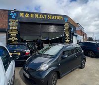 M and H MOT Station Ltd Logo